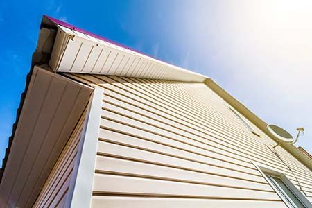 house with cream color lap siding